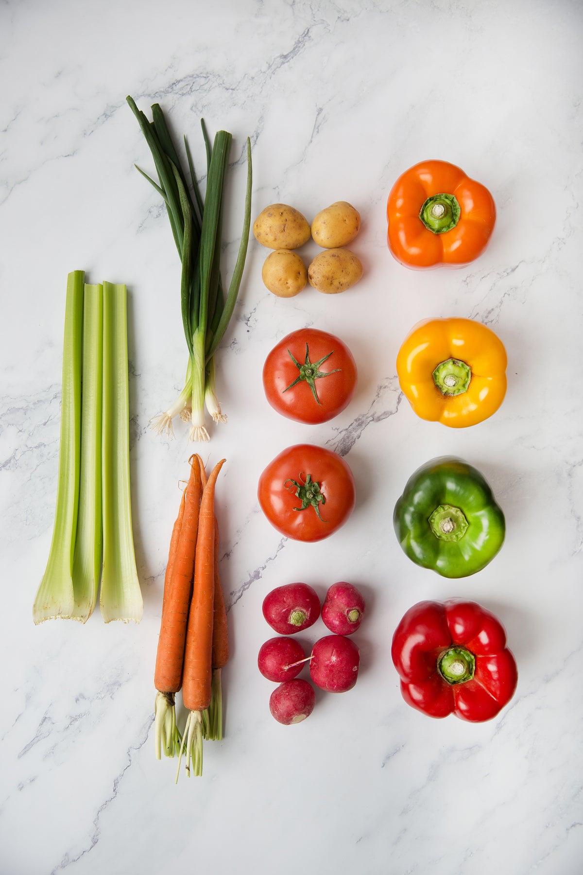 Fresh vegetables arranged on a light surface