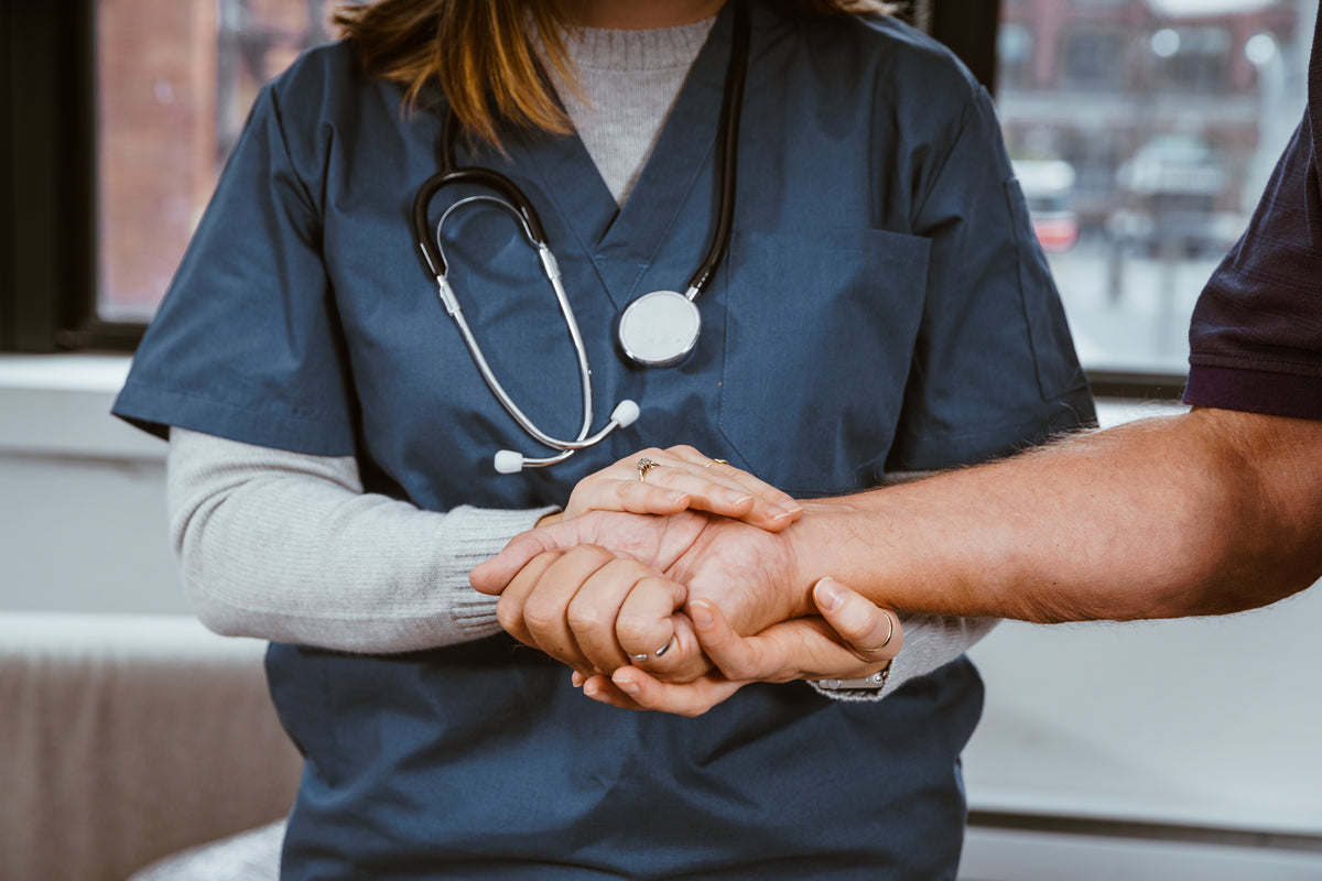 A healthcare professional supporting a patient
